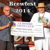 Lemoore Senior Center President Richard Rea receives a check from Lemoore Lions President Greg Martella.